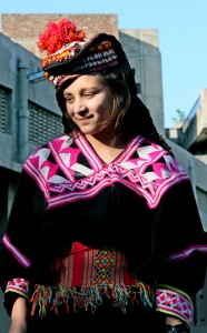 This girl is a very special tribe found in Pakistan's Northwest Frontier. Notice the tiny shells adorned in her cap. 