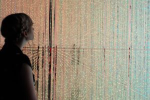 A photo I took of my friend in TeamLab. This room was filled with strings of lights that were constantly changing.