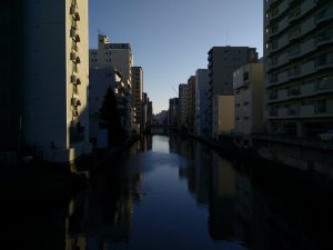Reflections of buildings in a canal in Nagoya, taken on a trip just past new year. 