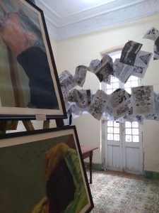 Exhibition at a back-garden arts festival. On the line are pamphlets published by a Cuban writing collective.