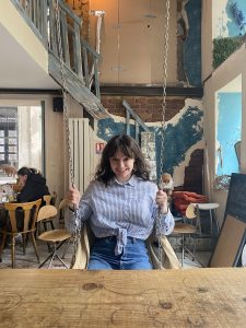 Me on a swing chair in a cool café we found in Lyon