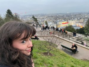 Me and the view over Paris from the top of the hill of Montmartre