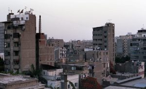 View over Cairo's rooftops. As there isn't much social housing available, lots of the taller towers are built by citizens' cooperatives.