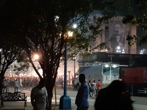 Students gather at the steps of la Universidad de La Habana carrying torches. A flag of José Martí is draped over the Philosophy Department building. The Cuban state has organised this event in celebration of the writer's birthday.