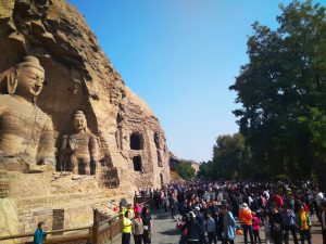 The fantastic Buddhist statues and the accompanying crowds