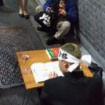 This guy was dressed up as a student studying for the university exams.
