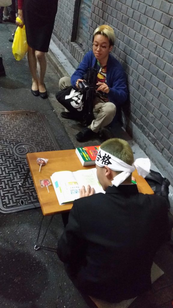 This guy was dressed up as a student studying for the university exams.