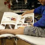 One nighttime ritual was me and the youngest boy playing or reading books together. This photo was from one of the times he was teaching me about dinosaurs.