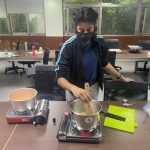 One of my classmates cooking in class
